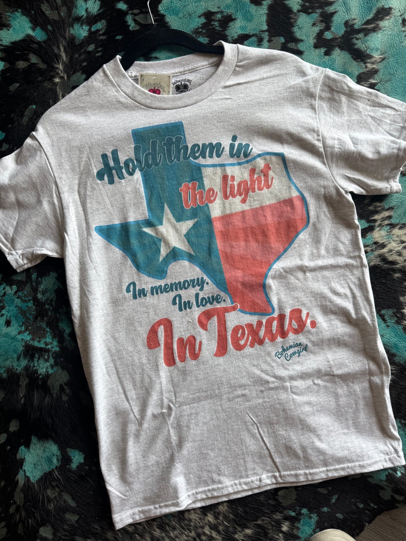 HOLD THEM IN THE LIGHT IN THE MEMORY IN LOVE. IN TEXAS